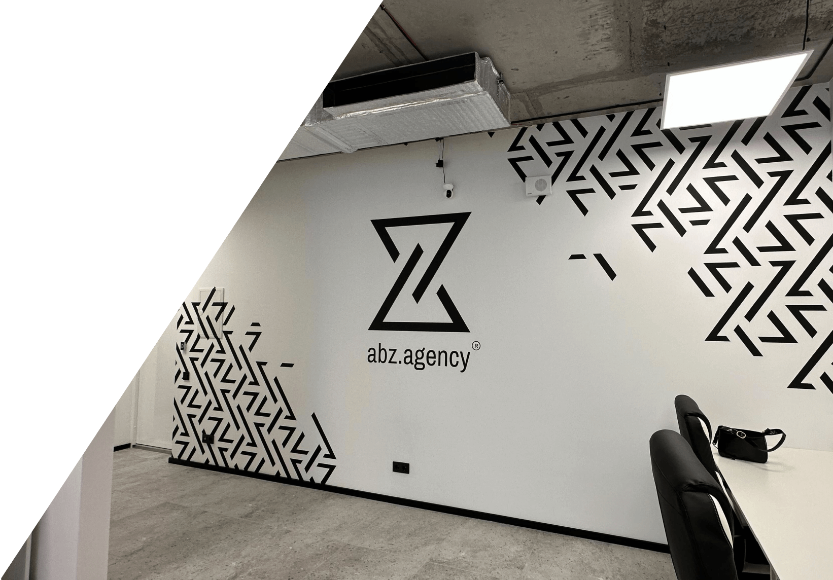 Corner patterns illustration of abz.agency® on the wall